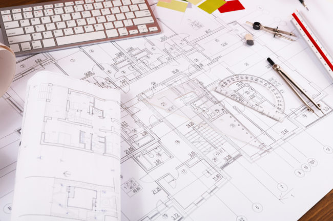 Architectural project, engineering tools on table. industrial-manufacturing-and-warehouse-facilities