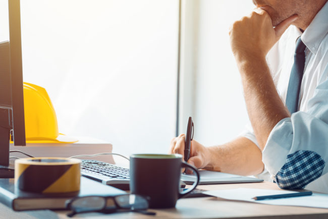 Civil engineer working with sketch pen tablet in architecture of